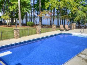 Inground pool with vivid blue liner